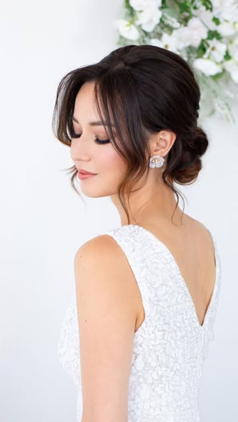 Polished Updo with Curtain Bangs